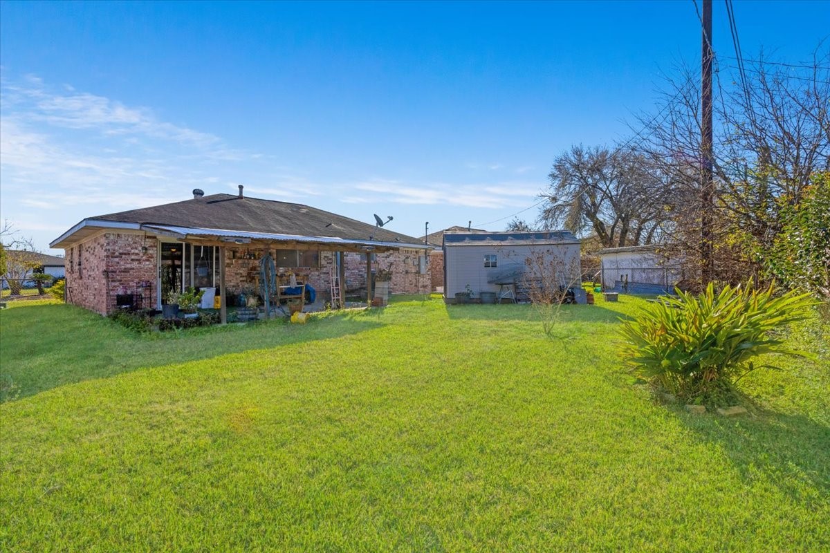 14518 Littleford Street Houston, TX 77045 - Photo 12 of 16 a view of a house with a yard