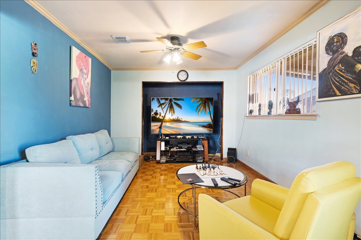 14518 Littleford Street Houston, TX 77045 - Photo 3 of 16 a living room with furniture and a flat screen tv