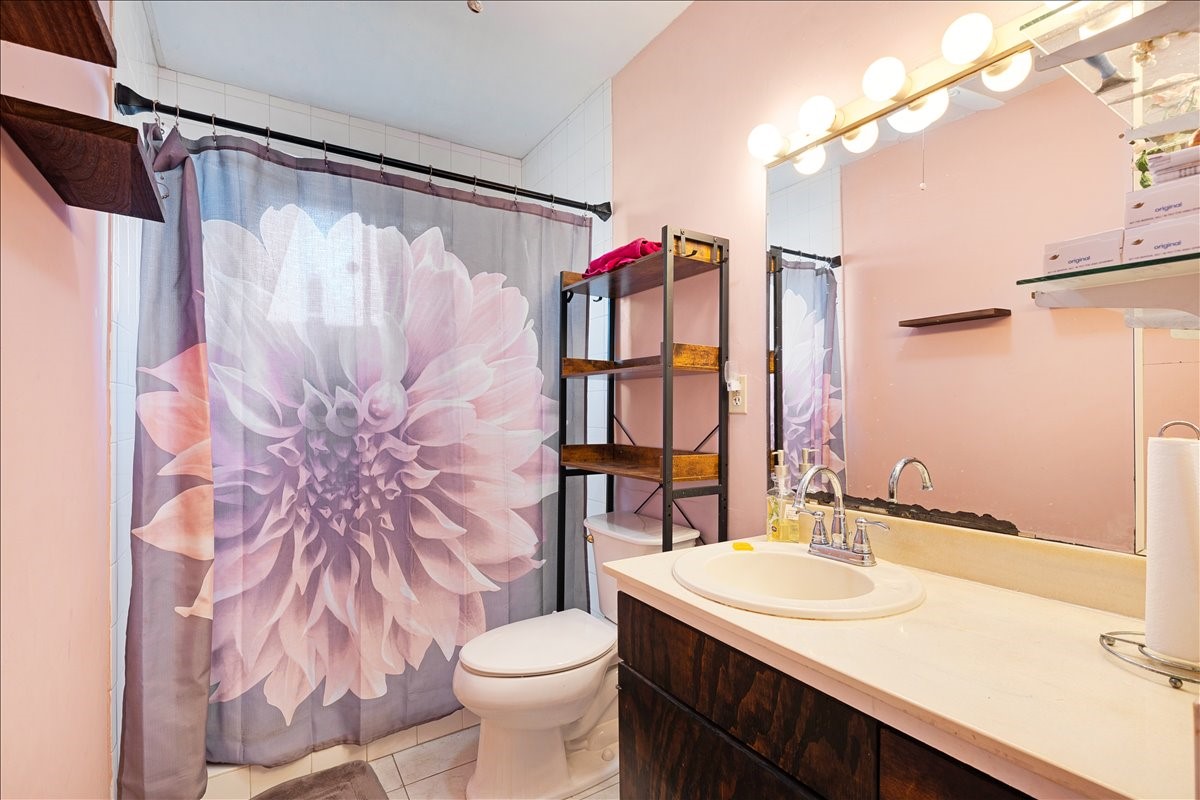 14518 Littleford Street Houston, TX 77045 - Photo 8 of 16 a bathroom with a sink toilet and shower