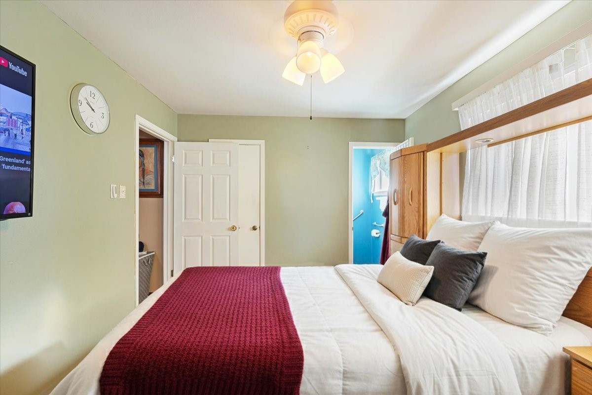 14518 Littleford Street Houston, TX 77045 - Photo 10 of 16 a bedroom with a bed and a chandelier