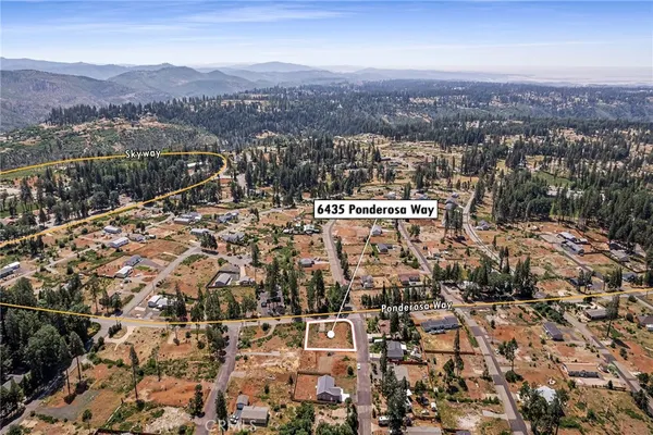 an aerial view of residential house and car parked