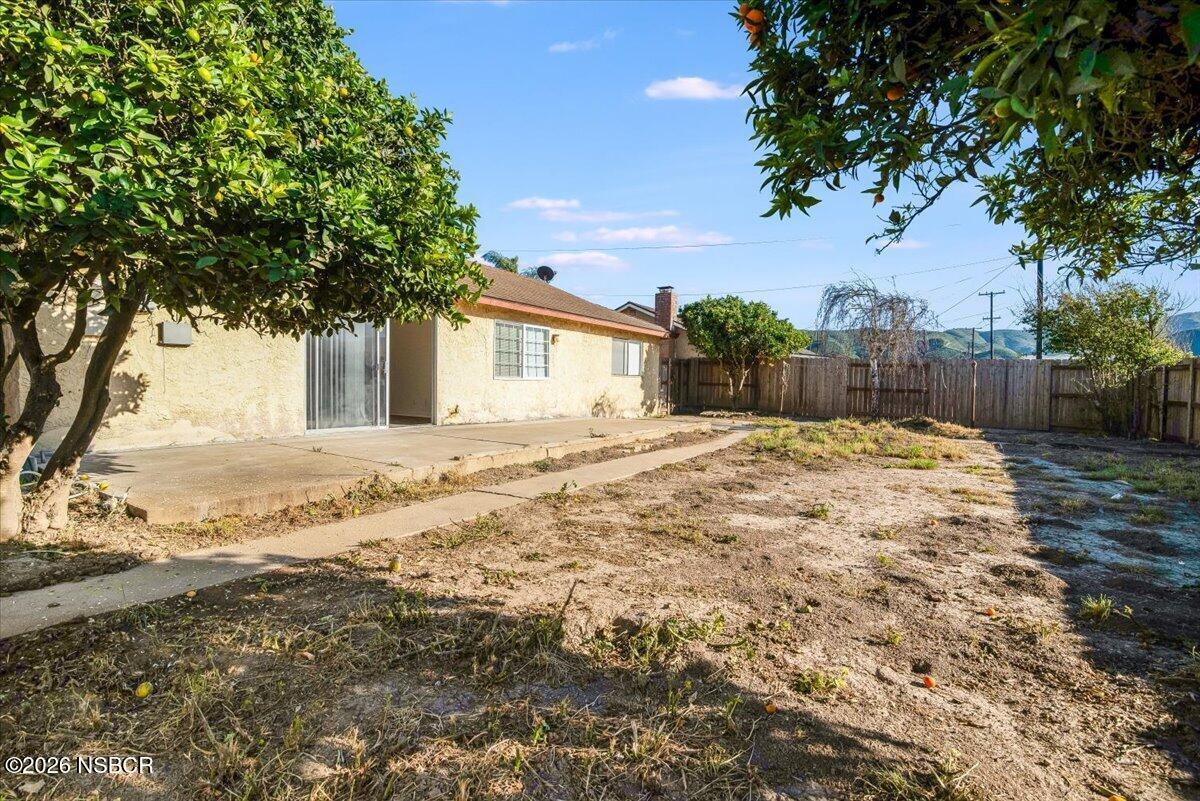 321 North Z Street Lompoc, CA 93436 - Photo 25 of 33 a large white house with a large tree in front of it