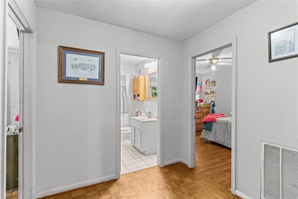 1122 Ridgeleigh Circle Dalton, GA 30720 - Photo 17 of 36 a view of a hallway with closet and wooden floor