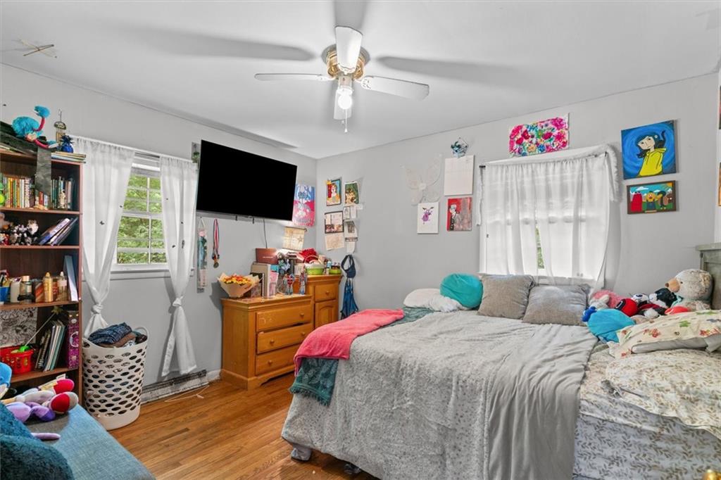 1122 Ridgeleigh Circle Dalton, GA 30720 - Photo 19 of 36 a bedroom with a bed and a flat screen tv