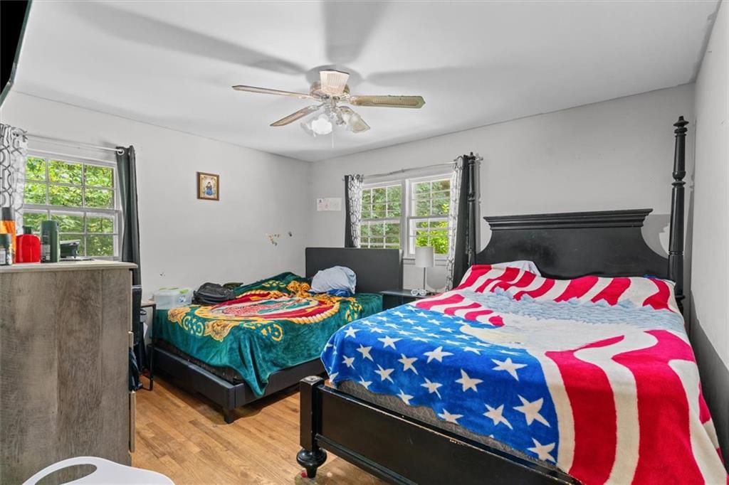 1122 Ridgeleigh Circle Dalton, GA 30720 - Photo 22 of 36 a bedroom with two beds and a chandelier