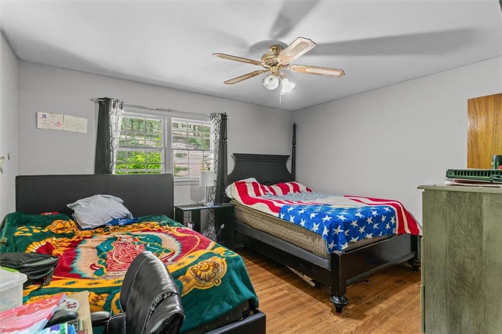 1122 Ridgeleigh Circle Dalton, GA 30720 - Photo 23 of 36 a bedroom with a bed and a chandelier