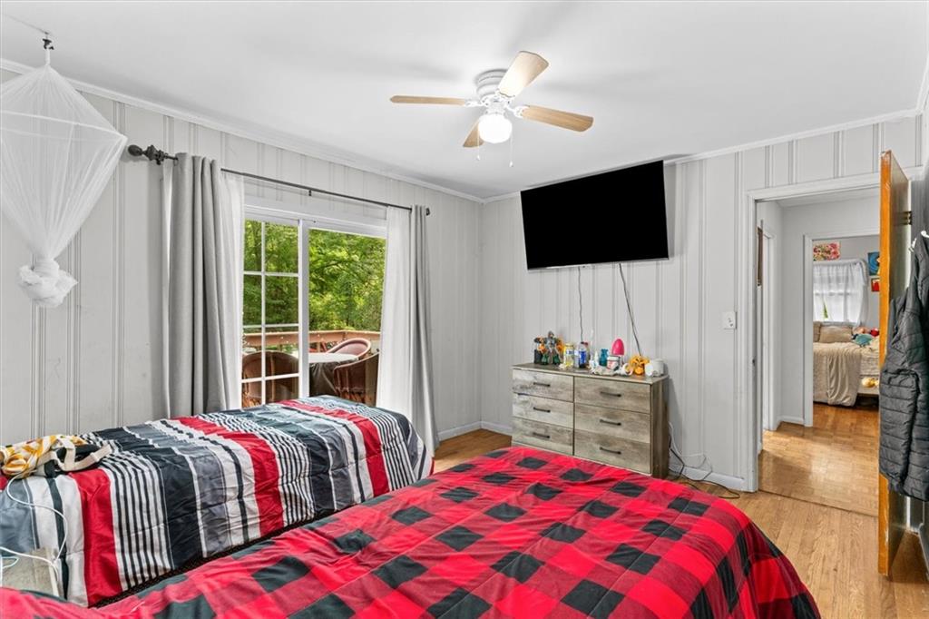 1122 Ridgeleigh Circle Dalton, GA 30720 - Photo 25 of 36 a bedroom with two beds and a flat screen tv