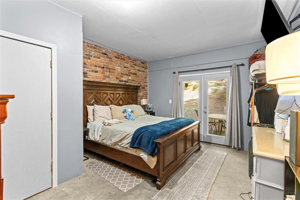 1122 Ridgeleigh Circle Dalton, GA 30720 - Photo 27 of 36 a bedroom with a bed and a refrigerator