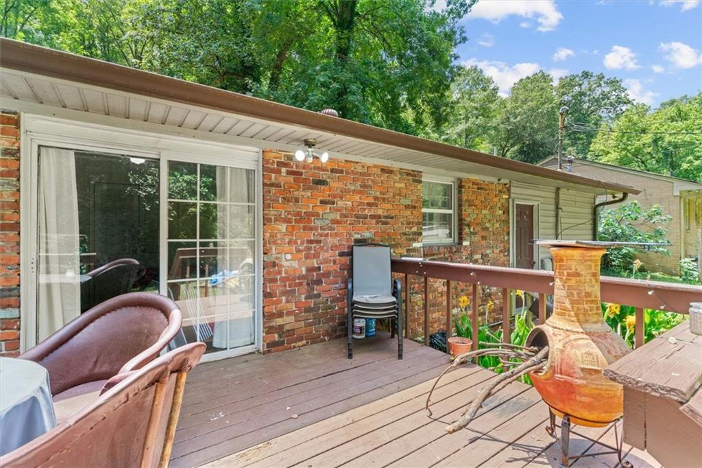 1122 Ridgeleigh Circle Dalton, GA 30720 - Photo 31 of 36 a view of a patio with couches chairs potted plants and wooden floor