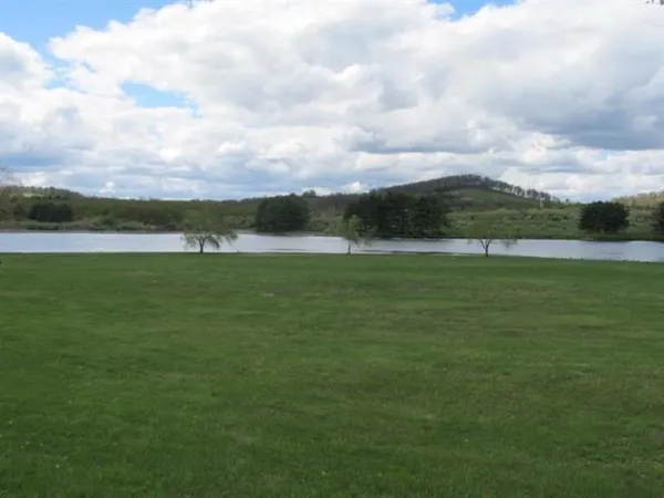 a view of a lake with a big yard