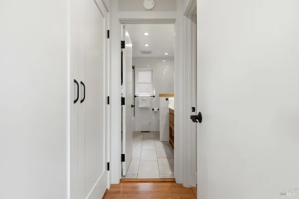 a bathroom with a glass shower door