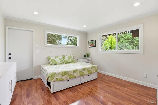 a bedroom with a bed and a table