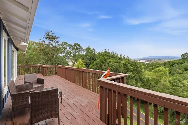a view of balcony with furniture