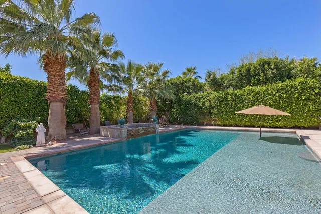 a view of a backyard with a trampoline