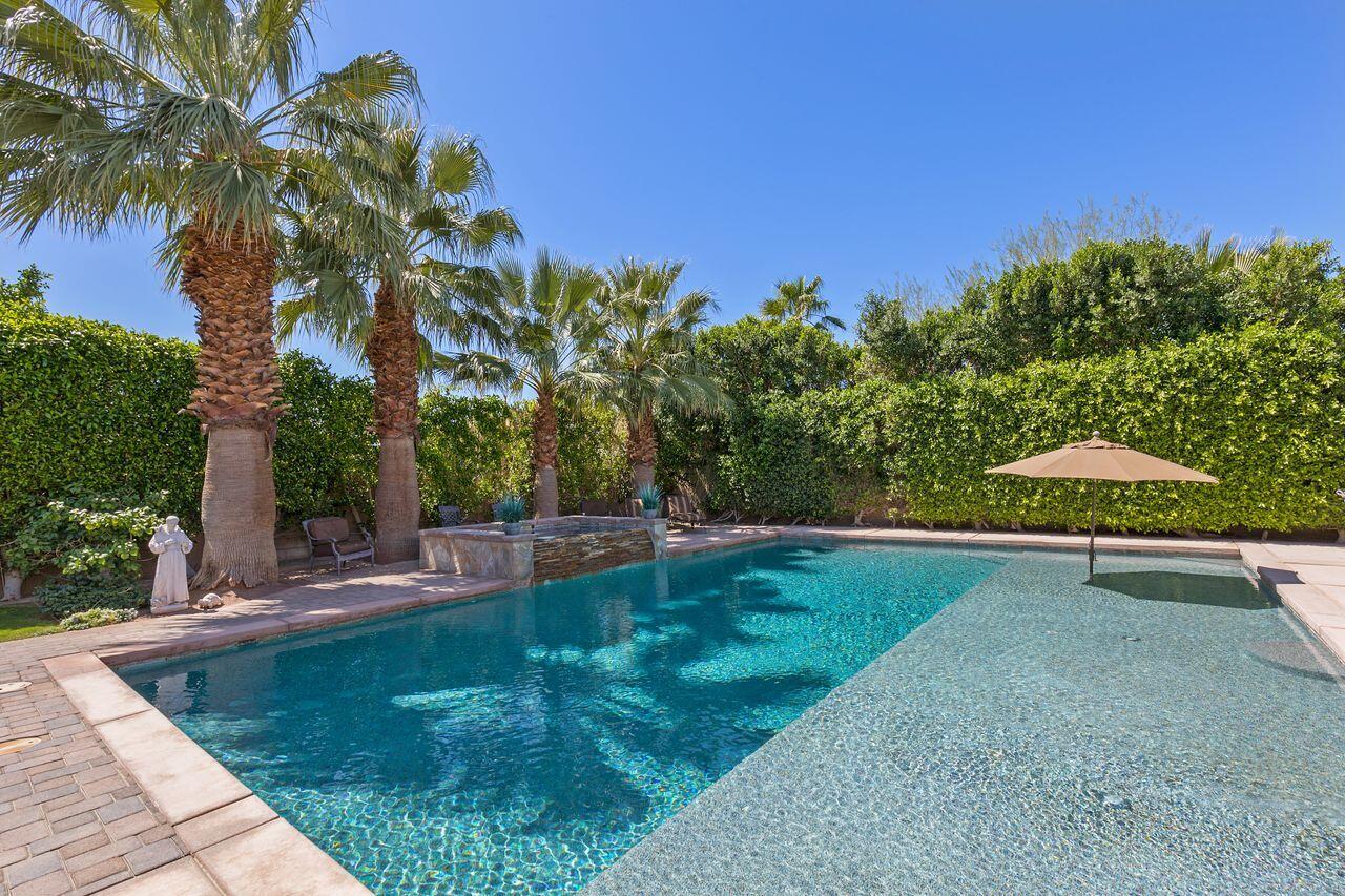 80591 Tangelo Court Indio, CA 92201 - Photo 13 of 30 a view of a backyard with a trampoline