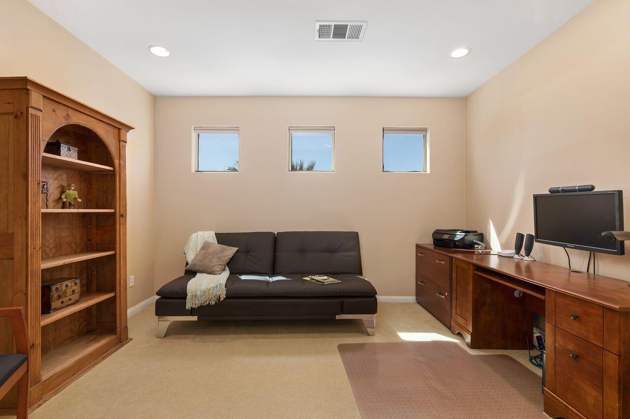 80591 Tangelo Court Indio, CA 92201 - Photo 16 of 30 a living room with furniture and a flat screen tv