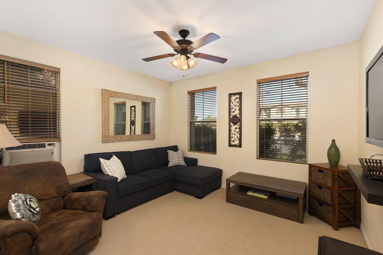 80591 Tangelo Court Indio, CA 92201 - Photo 22 of 30 a living room with furniture ceiling fan and a window