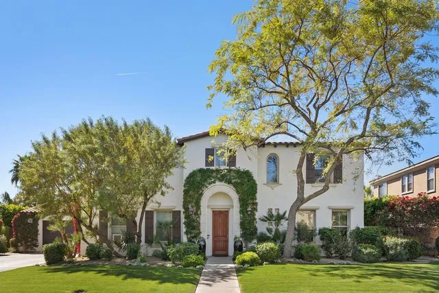a front view of a building with garden