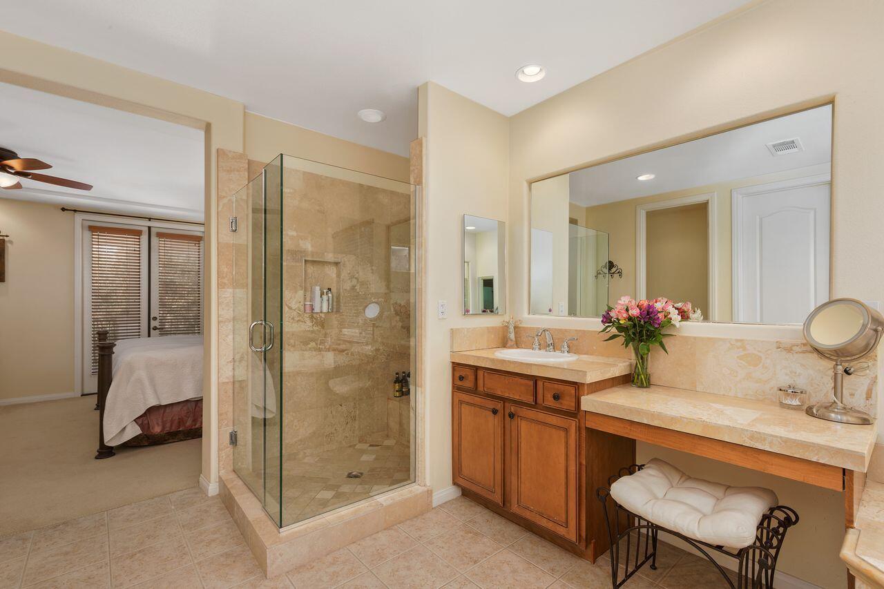 80591 Tangelo Court Indio, CA 92201 - Photo 7 of 30 a bathroom with a double vanity sink mirror and shower