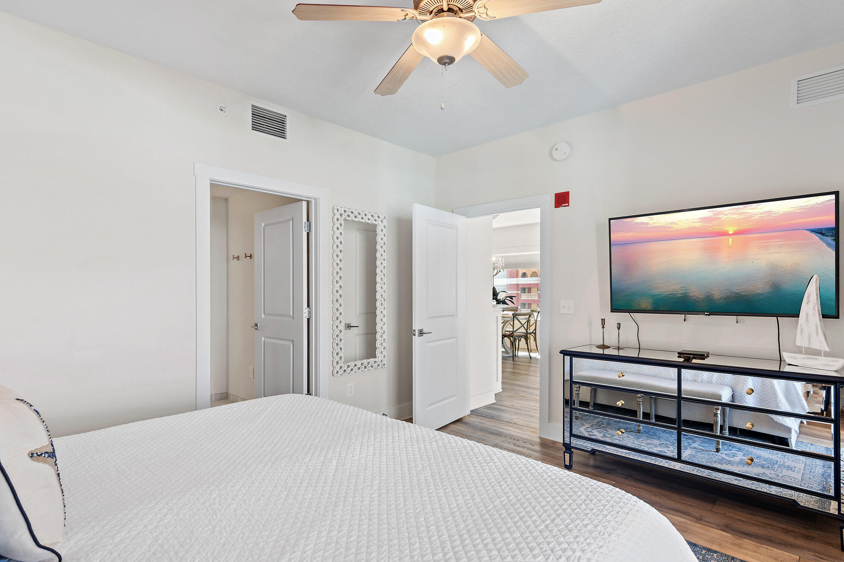 15928 Front Beach Road, Unit 601 Panama City Beach, FL 32413 - Photo 16 of 39 a bedroom with furniture and a flat screen tv