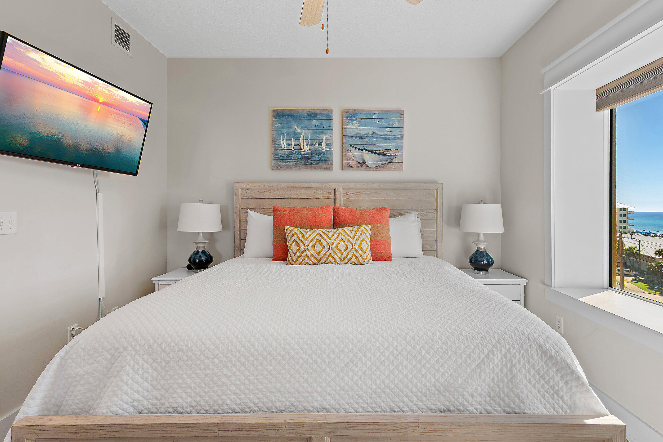 15928 Front Beach Road, Unit 601 Panama City Beach, FL 32413 - Photo 24 of 39 a bedroom with a bed and a flat screen tv