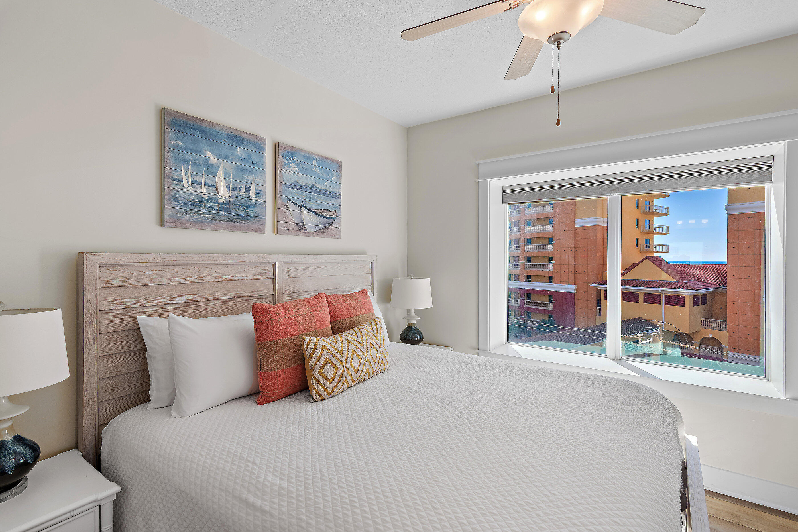 15928 Front Beach Road, Unit 601 Panama City Beach, FL 32413 - Photo 26 of 39 a bedroom with a large bed and a large window