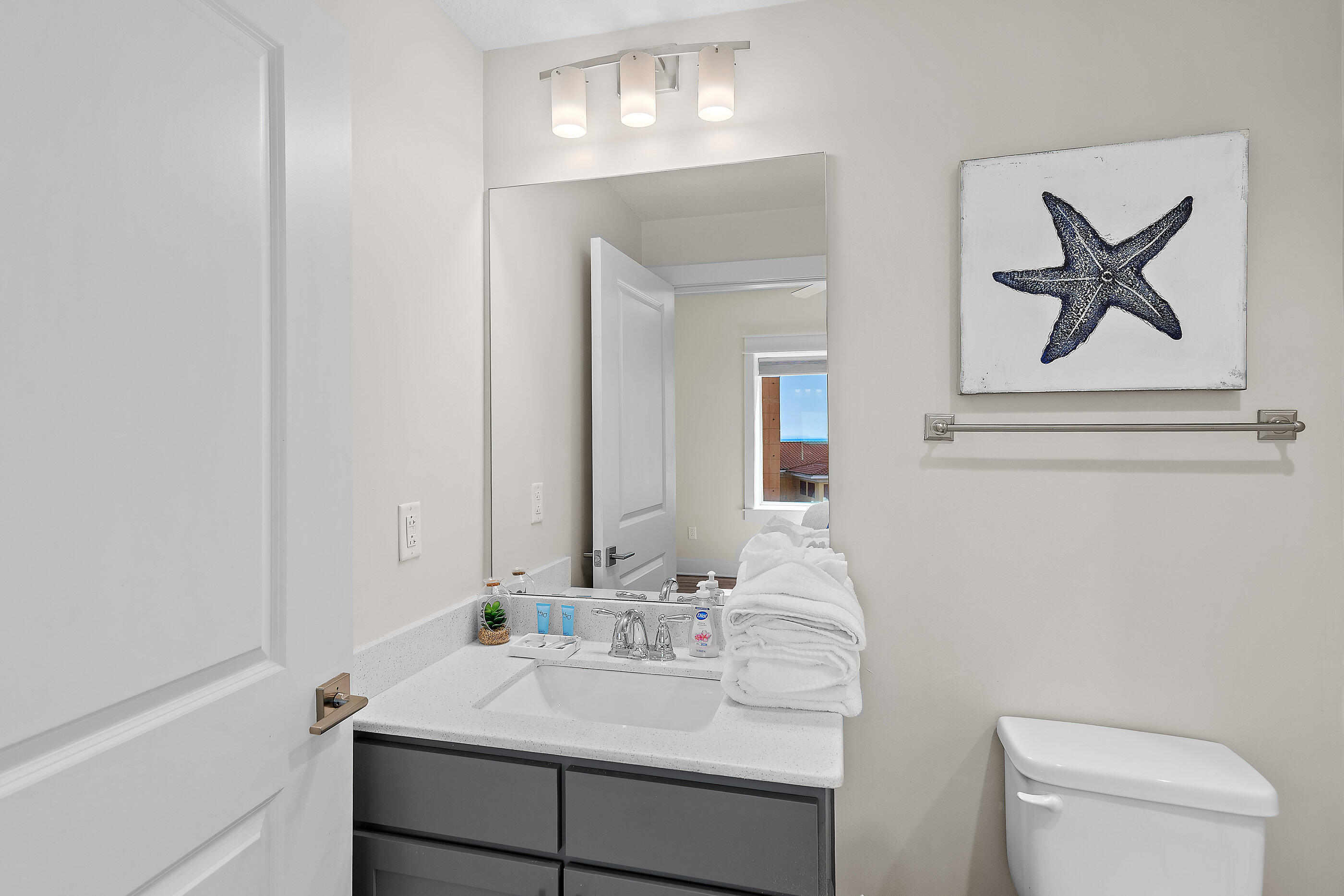 15928 Front Beach Road, Unit 601 Panama City Beach, FL 32413 - Photo 28 of 39 a bathroom with a sink vanity and toilet