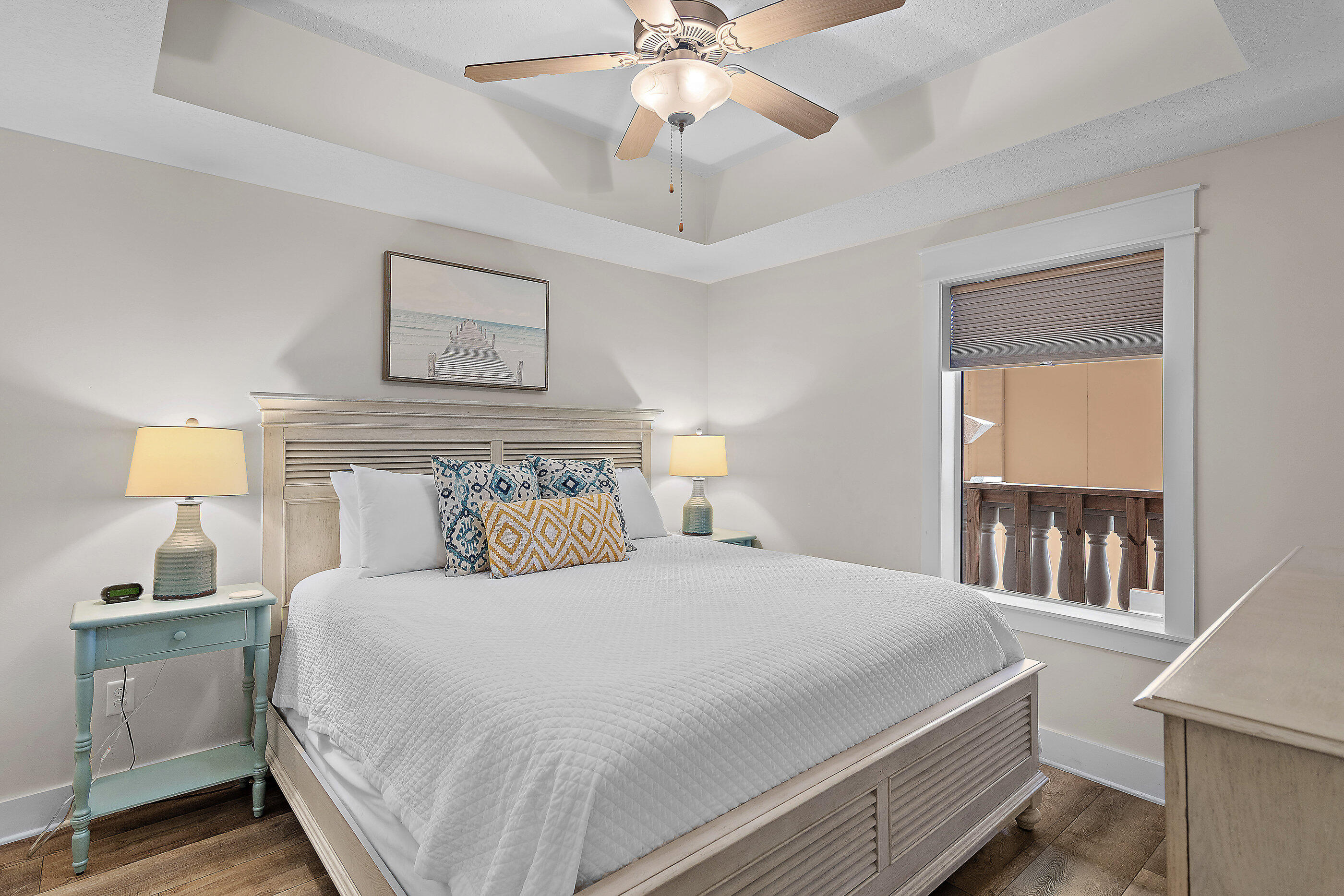 15928 Front Beach Road, Unit 601 Panama City Beach, FL 32413 - Photo 29 of 39 a bedroom with a large bed and a chandelier