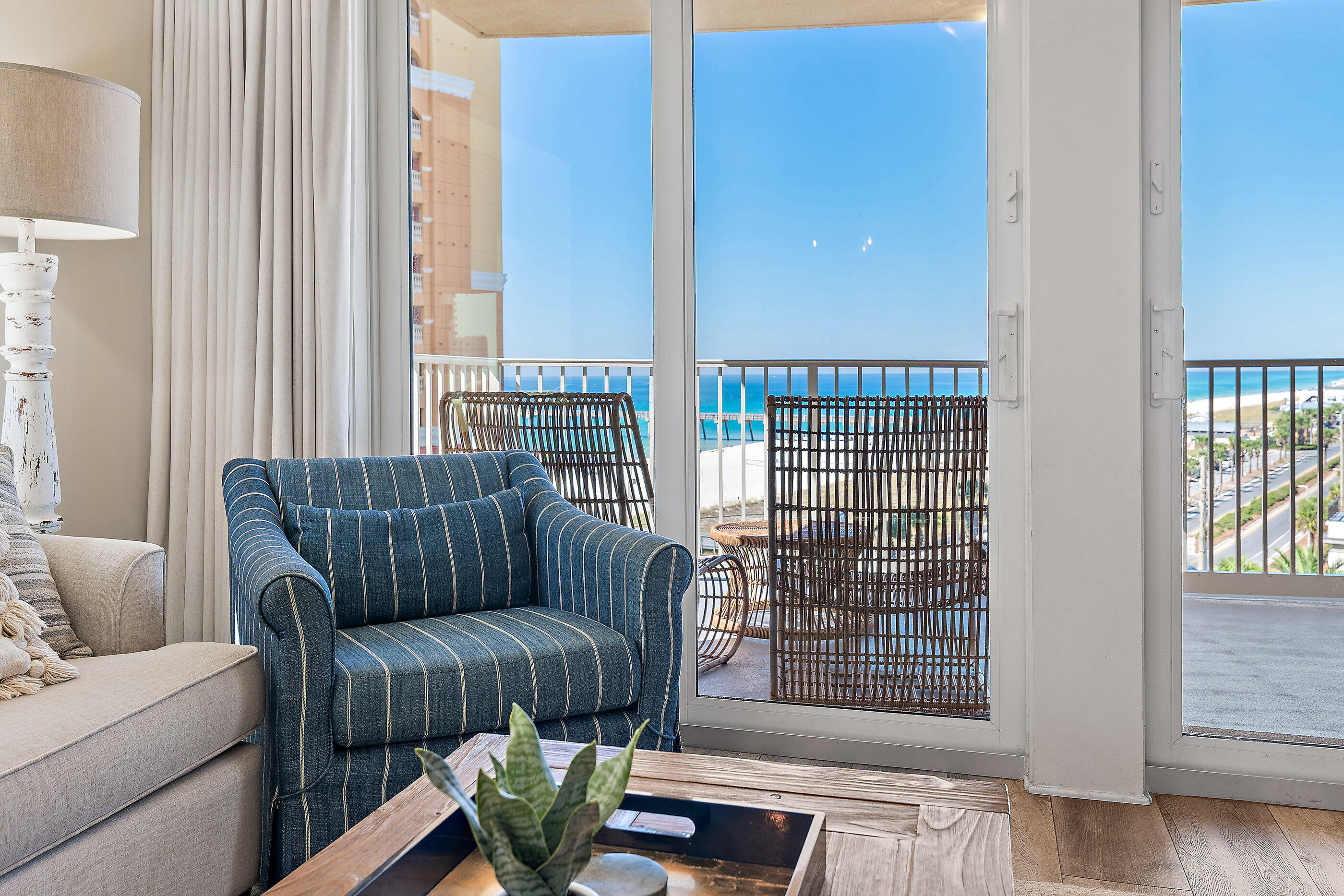 15928 Front Beach Road, Unit 601 Panama City Beach, FL 32413 - Photo 3 of 39 a living room with furniture and a floor to ceiling window