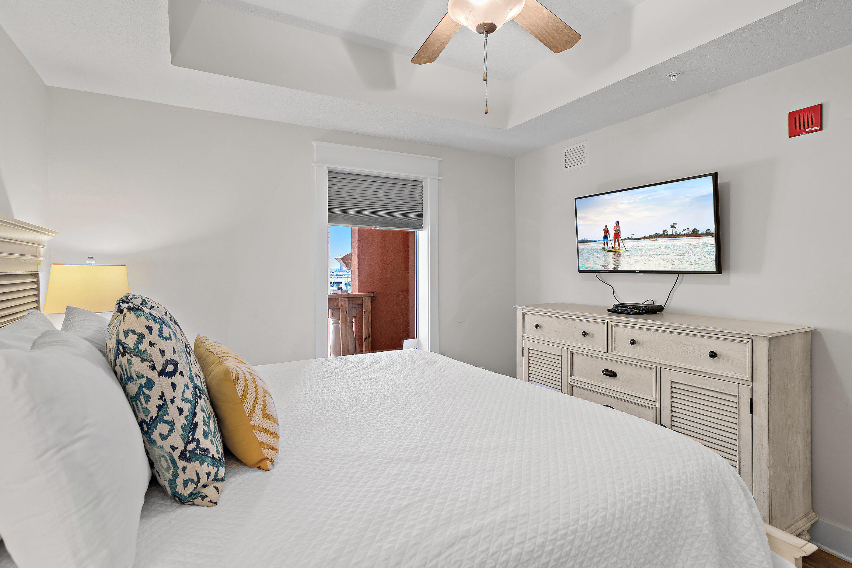 15928 Front Beach Road, Unit 601 Panama City Beach, FL 32413 - Photo 31 of 39 a bedroom with a large bed and a chandelier