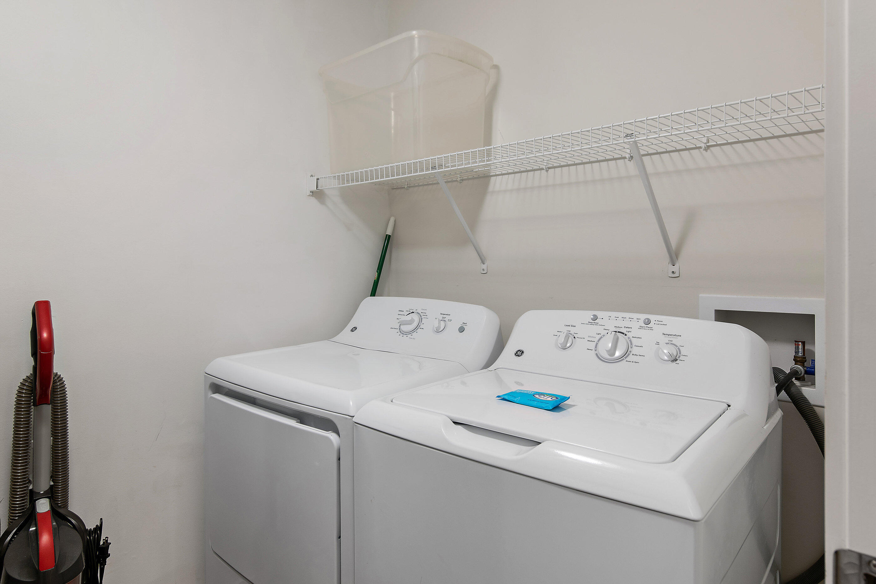 15928 Front Beach Road, Unit 601 Panama City Beach, FL 32413 - Photo 33 of 39 a utility room with dryer and washer