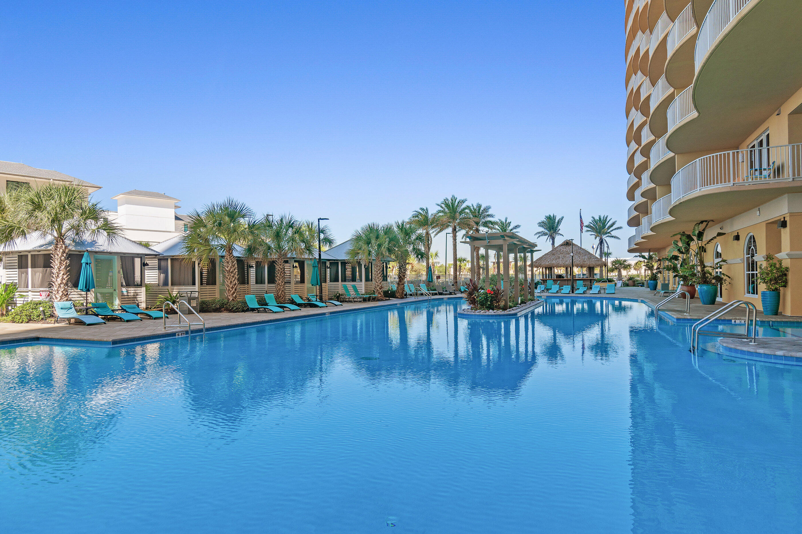 15928 Front Beach Road, Unit 601 Panama City Beach, FL 32413 - Photo 36 of 39 a view of swimming pool with outdoor seating and plants