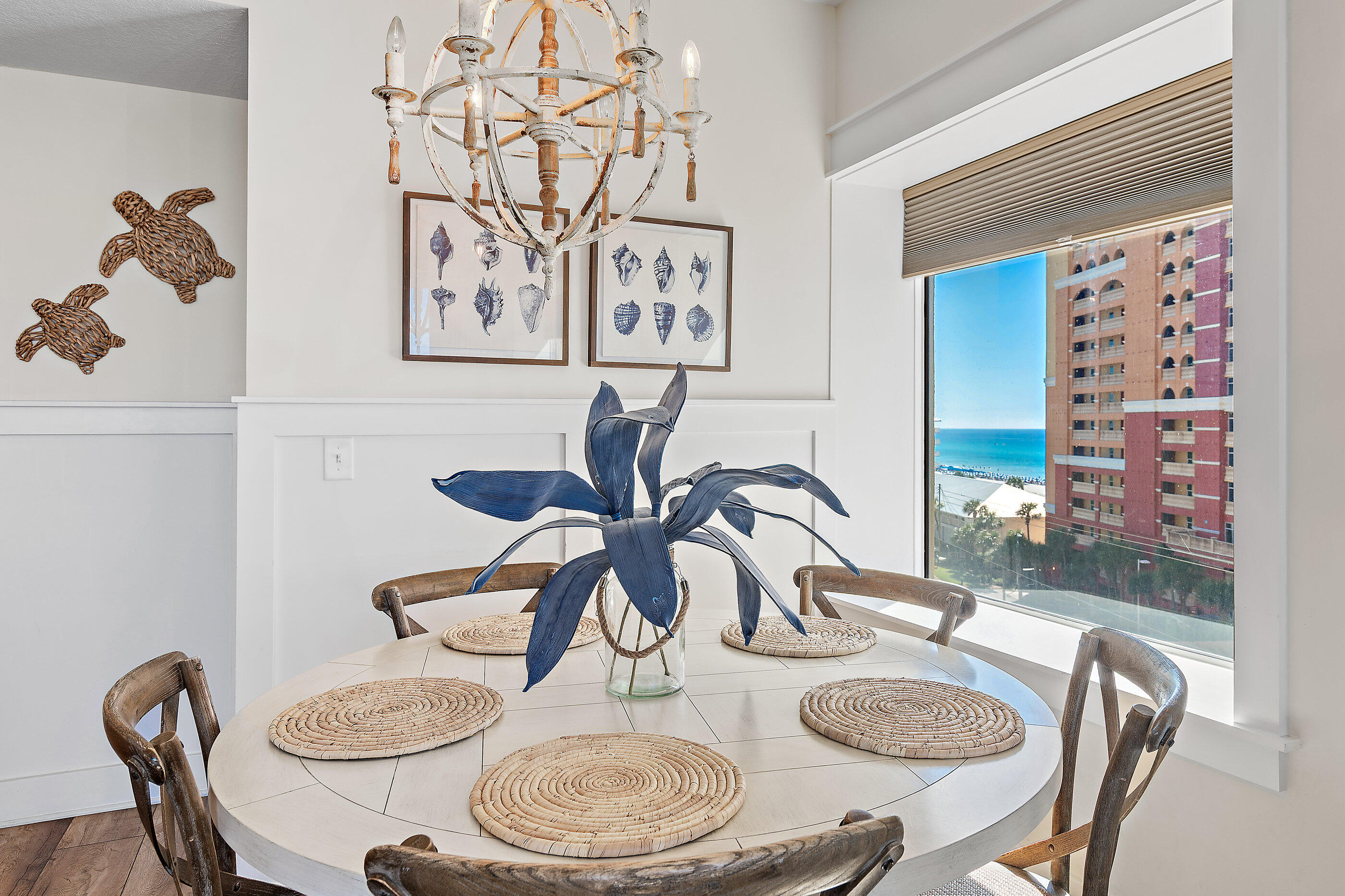 15928 Front Beach Road, Unit 601 Panama City Beach, FL 32413 - Photo 7 of 39 a dining room with furniture and wooden floor