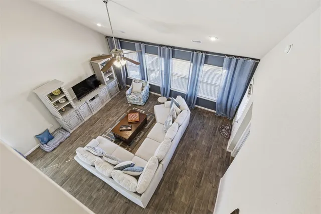 a view of living room with furniture and window