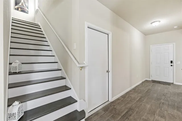 a view of entryway with wooden floor