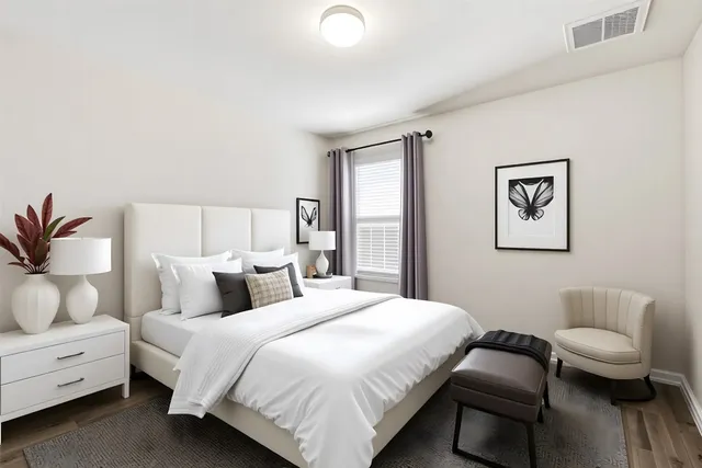 a bedroom with a bed and a couch