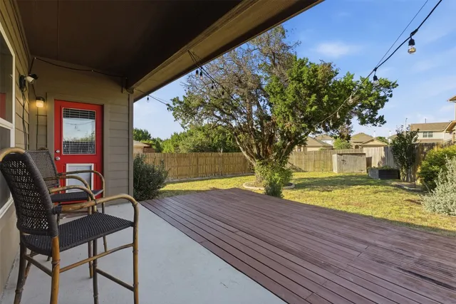 a view of a backyard with sitting area