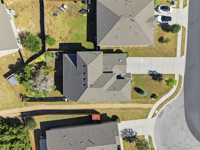 an aerial view of a house with swimming pool
