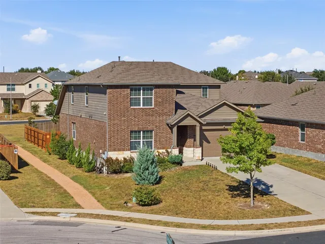 a front view of a house with yard