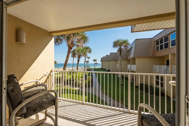 a view of balcony with furniture
