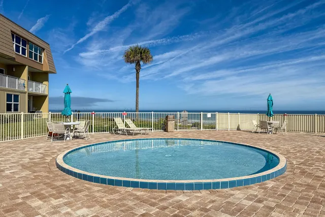 a view of a swimming pool with a building