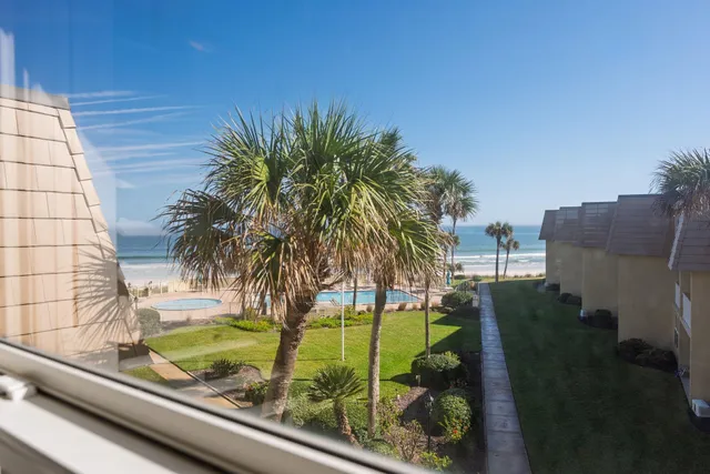 a view of swimming pool from a balcony