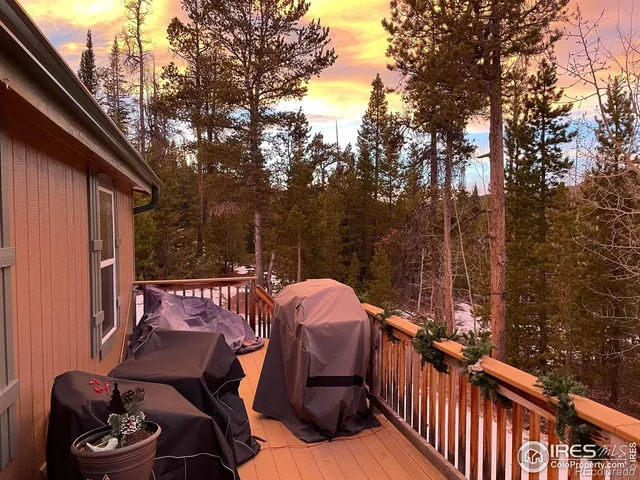 a view of balcony with wooden floor