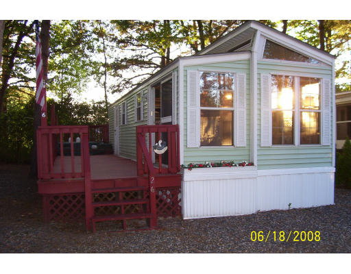 Lot 26 State Road Seabrook, NH 03874 - Photo 1 of 1 a front view of a house with garden