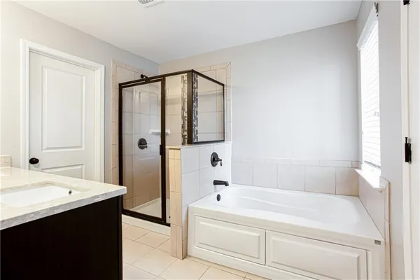 a bathroom with a bathtub and a sink