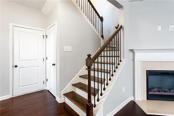 a view of staircase with wooden floor and staircase