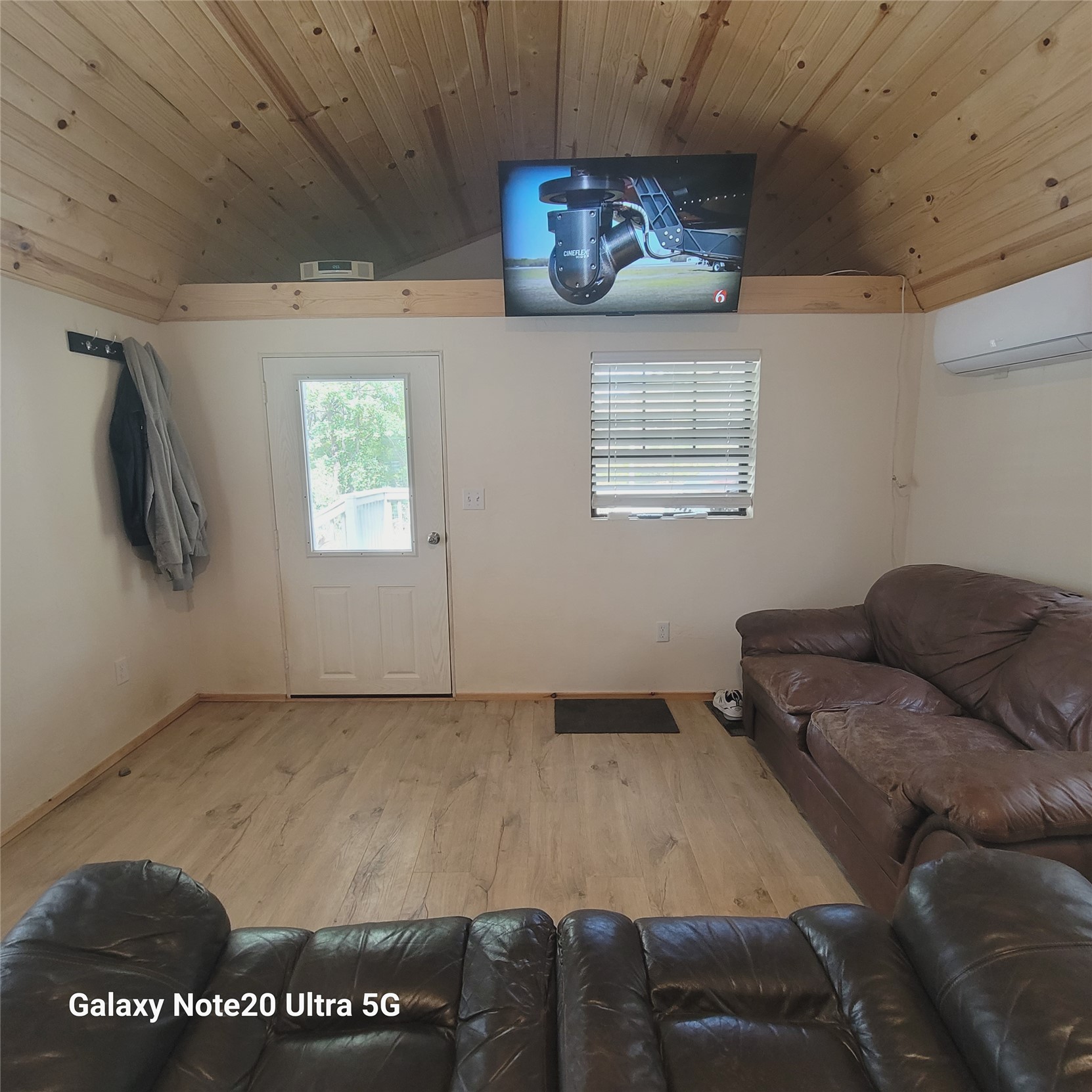 115 Locust Road Stigler, OK 74462 - Photo 16 of 29 Wood-finish flooring, white walls, and a wood-paneled vaulted ceiling