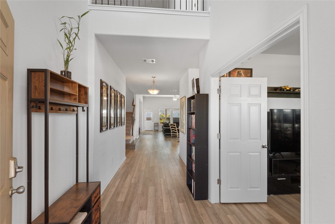 932 Medina Way Leander, TX 78641 - Photo 5 of 28 Hallway with light wood-type flooring