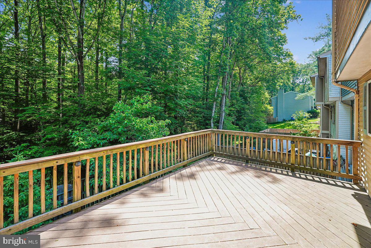 2331 Middle Creek Lane Reston, VA 20191 - Photo 5 of 78 a view of balcony with wooden floor and fence
