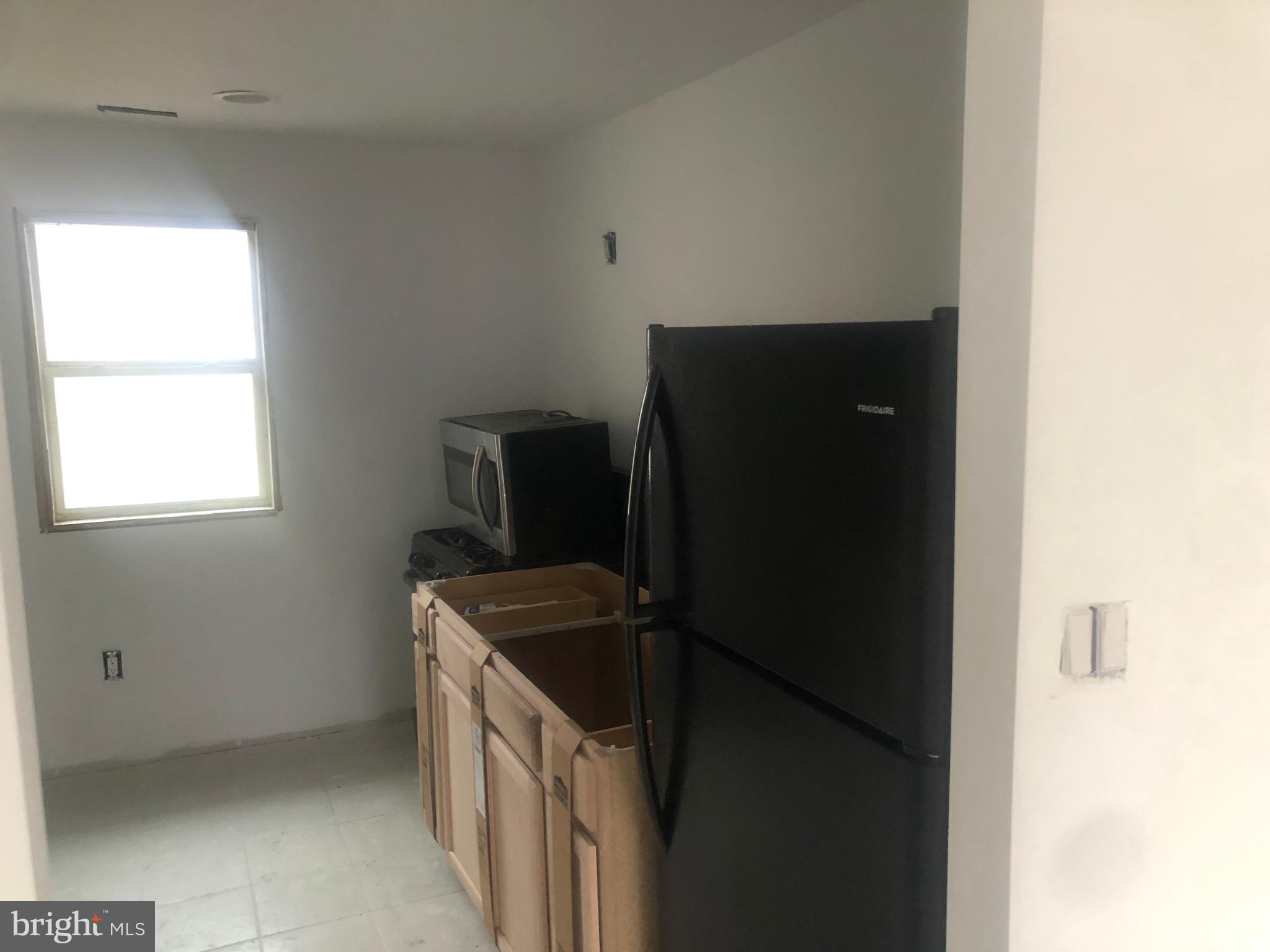 193 Kinsley Road Pemberton, NJ 08068 - Photo 12 of 22 a kitchen with a refrigerator and a stove